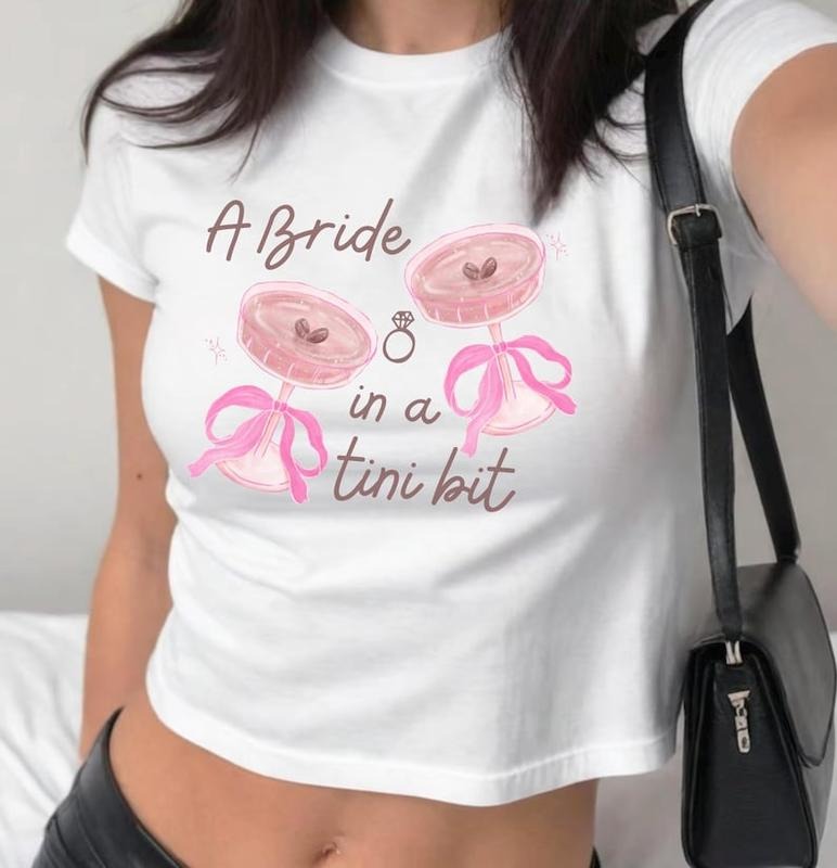 A Bride In a Tini Bit Baby Tee Womens Shirt, Cute Bridal Shower Gift T-Shirt, Bride Baby Tee, Bachelorette Outfit,...