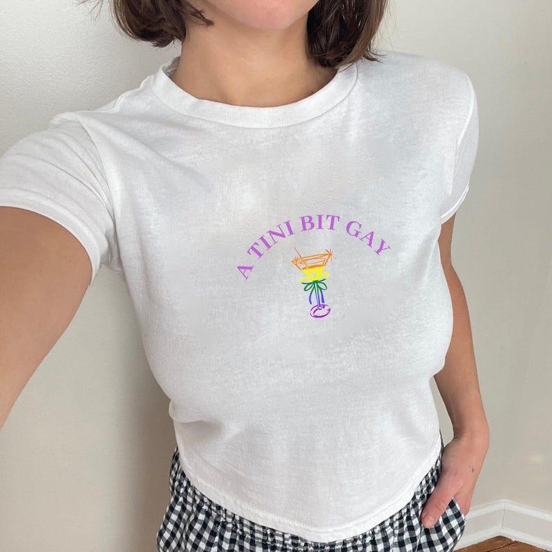 A Tini Bit Gay Lesbian Baby Tee, Gay Cowgirl Sapphic Femme Lesbian Top Subtle Bi Pride Baby Tee, WLW Pride Shirt Queer...