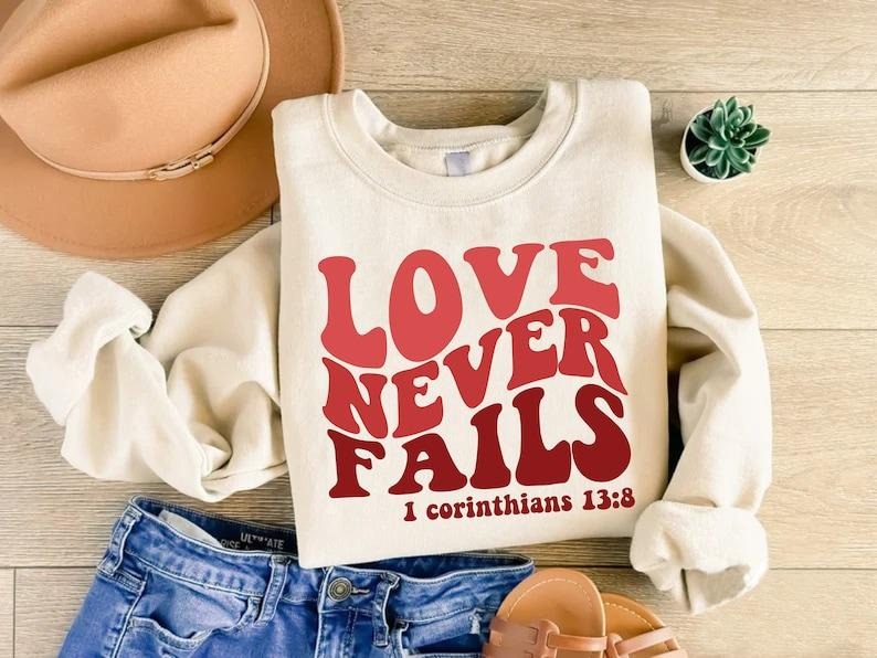 Bible Verse Christian Sweatshirt, Love Never Fails Sweatshirt, Valentines Day Gift, Religious Love Sweatshirt, Jesus Love...
