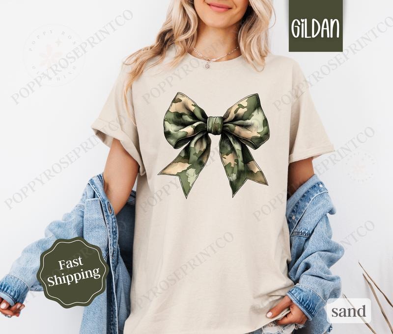 Camo Bow Shirt Gildan, Military Wife Tee, Coquette Bow Women's Tshirt Plus Sizes Hoodie, Sweatshirt | HypeCrazeTee.com