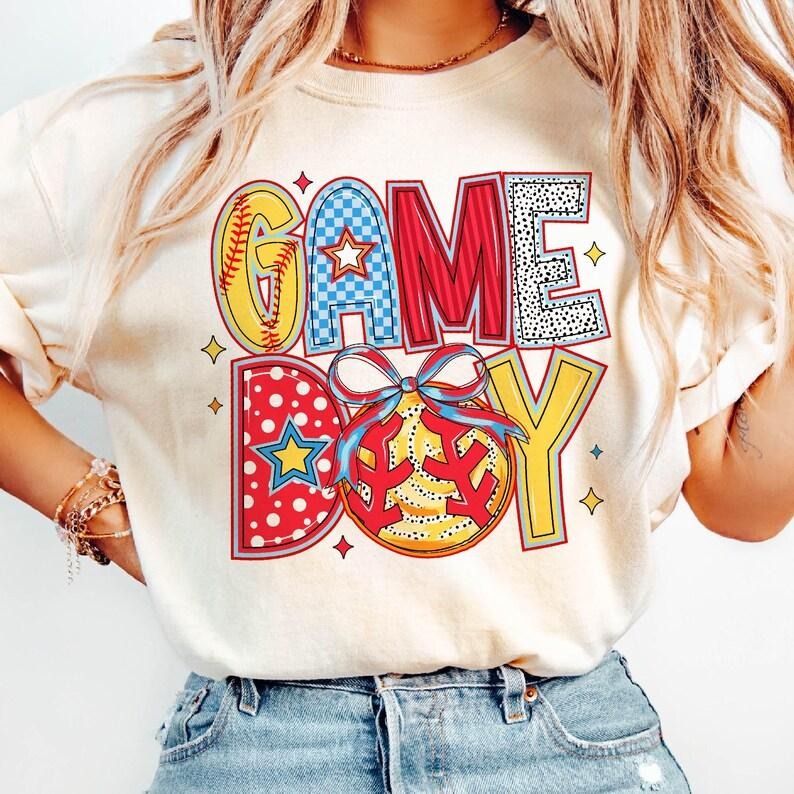 Coquette Softball Mama Game Day Brushstroke Tis the Season T-Shirt Hoodie, Sweatshirt | HypeCrazeTee.com