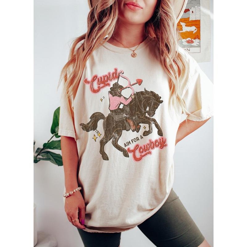 Cupid Aim For A Cowboy Vintage Comfort Colors Tshirt Hoodie, Sweatshirt | HypeCrazeTee.com
