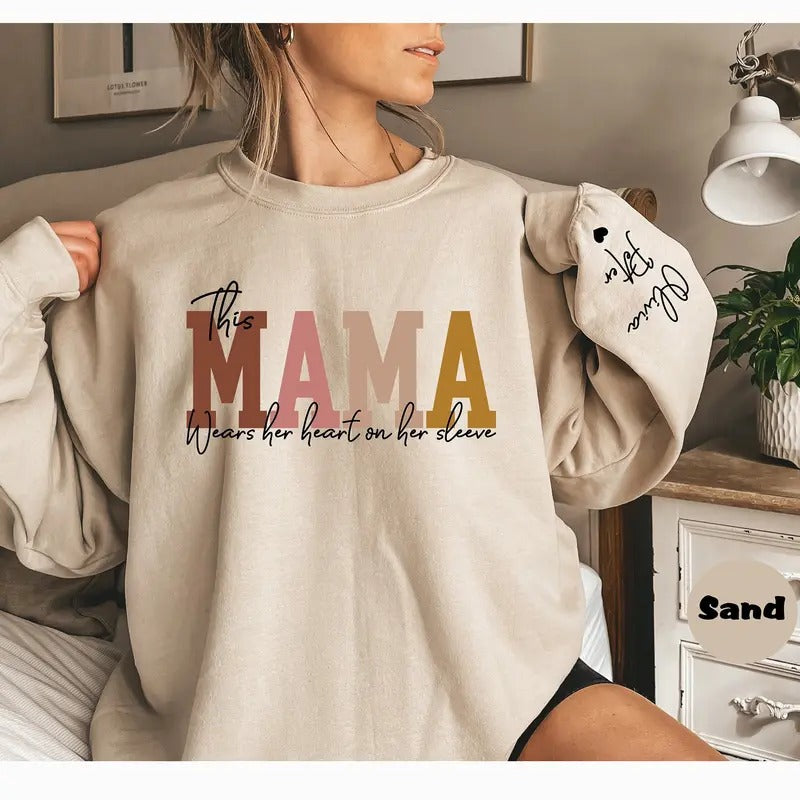 Custom This Mama Wears Her Heart On Her Sleeve Hoodie, Personalized Mom Sweatshirt With Kids Names, Cute Momma Outfit,...