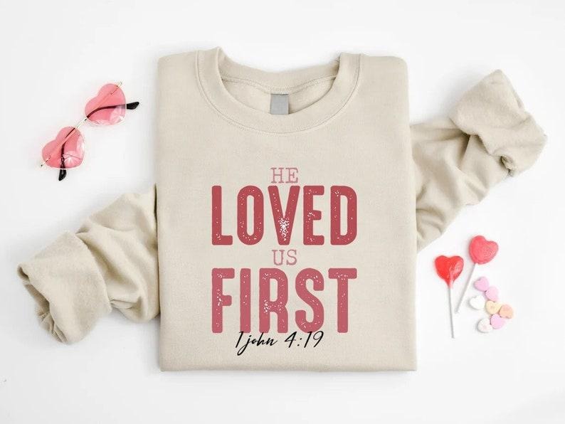 He Loved Us First Shirt Bible Verse Valentine Christian Christian Religious ; Cotton Menswear T-Shirts, Hoodie, Sweatshirt
