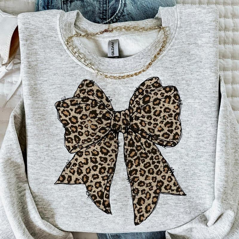 Leopard Coquette Bow Crewneck Shirt, Girly Bow Trending, Cheetah Bow Girl Hoodie, Sweatshirt | HypeCrazeTee.com