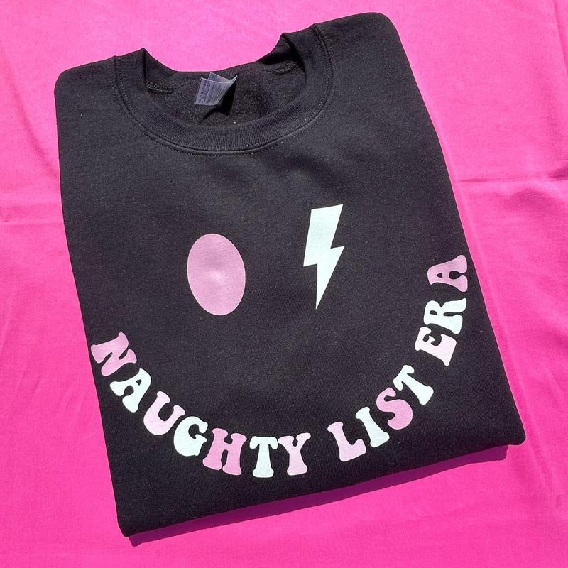 Naughty List Era Sweatshirt 'NLB' T-Shirts, Hoodie | HypeCrazeTee.com