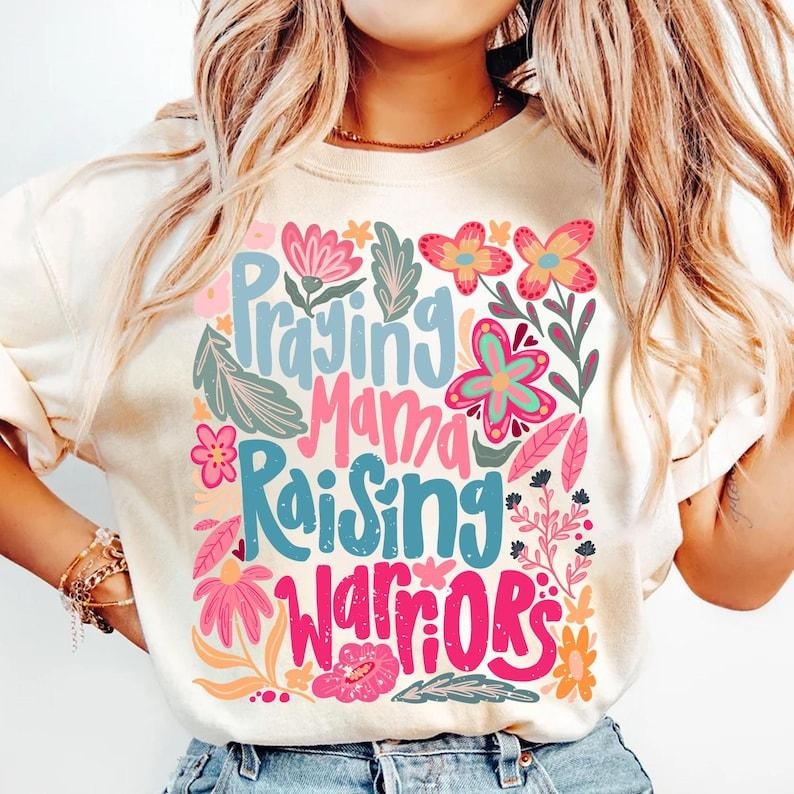 Praying Mama Raising Warriors Boho Floral Retro Wildflower Mother's Day T-Shirt Hoodie, Sweatshirt | HypeCrazeTee.com