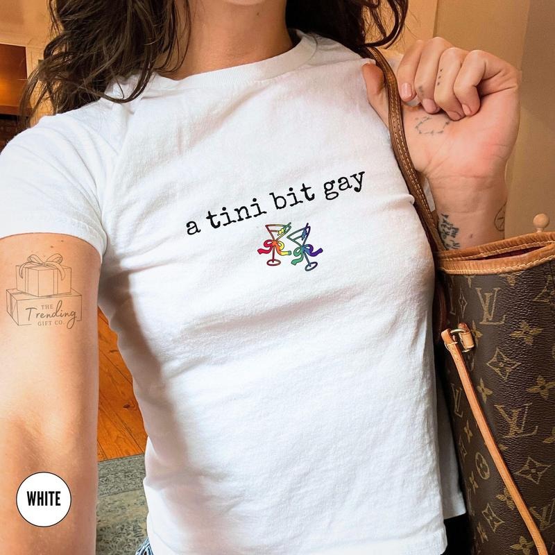 Subtle Lesbian Baby Tee, A Tini Bit Gay Sapphic Shirt, WLW Gift Ideas, Femme Pride Month Girlfriend Tee Queer Fashion,...