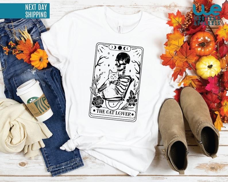 The Cat Lover Tarot Shirt | Tarot Card Shirt | Skeleton And Cat Shirt | Gift For Cat Lovers Hoodie and Sweater; T-shirt...