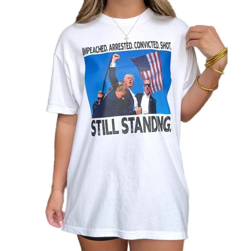 Trump Still Standing Tee, Impeached Arrested Convicted Shot Still Standing T-Shirt Hoodie, Sweatshirt | HypeCrazeTee.com