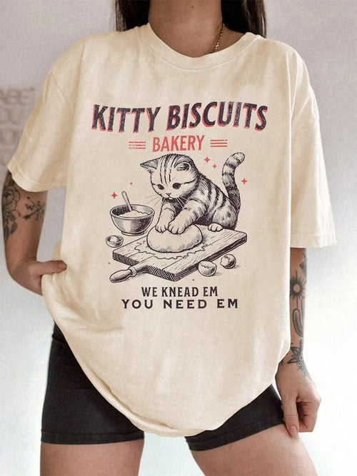 Unisex "Kitty Biscuits Bakery" Graphic T-Shirt with "We Knead Em You Need Em" Slogan, Cute Cat Baking Theme Cotton Tee...