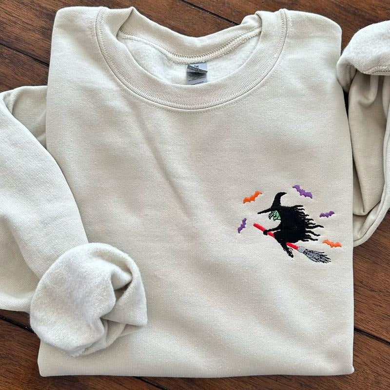 Witch Flying on a Broom Halloween Embroidered Crewneck Sweatshirt Comfort T-Shirts, Hoodie | HypeCrazeTee.com