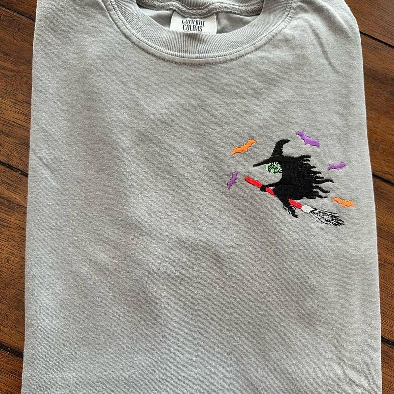 Witch On a Broom Halloween Embroidered Comfort colors Tee shirt Cute Hoodie, Sweatshirt | HypeCrazeTee.com