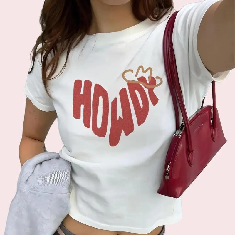Womens Baby Tee Howdy Heart Western Women's Tee Bold Red Typography Trending Cool Girl Design Cowboy Style Shirt Rodeo...