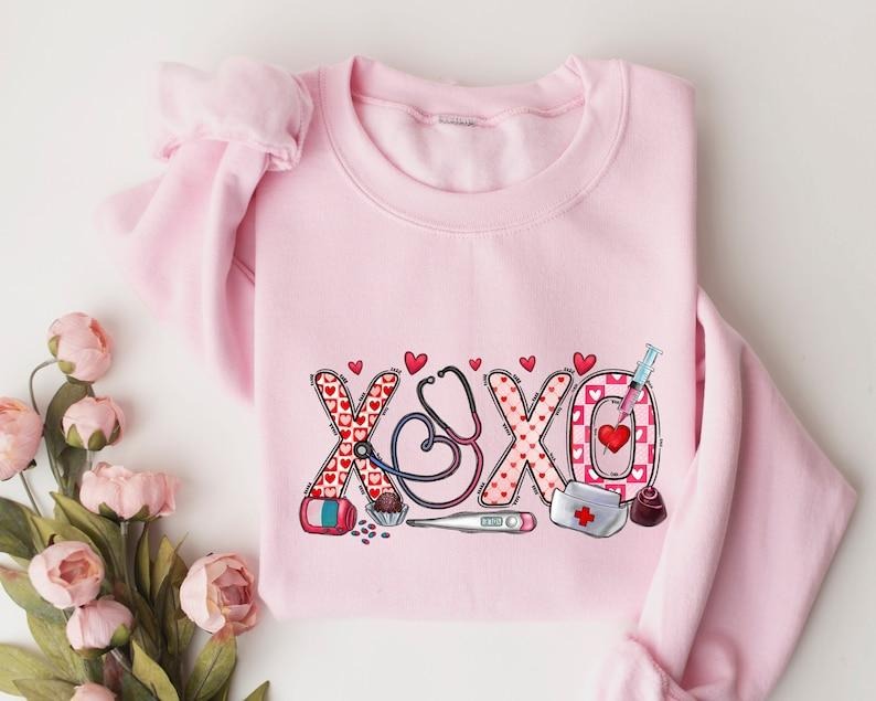 XOXO Nurse Sweatshirt, Valentines Day Shirt, Sweatshirt For Nurse, Valentines Day Gift for Nurse Hoodie | HypeCrazeTee.com
